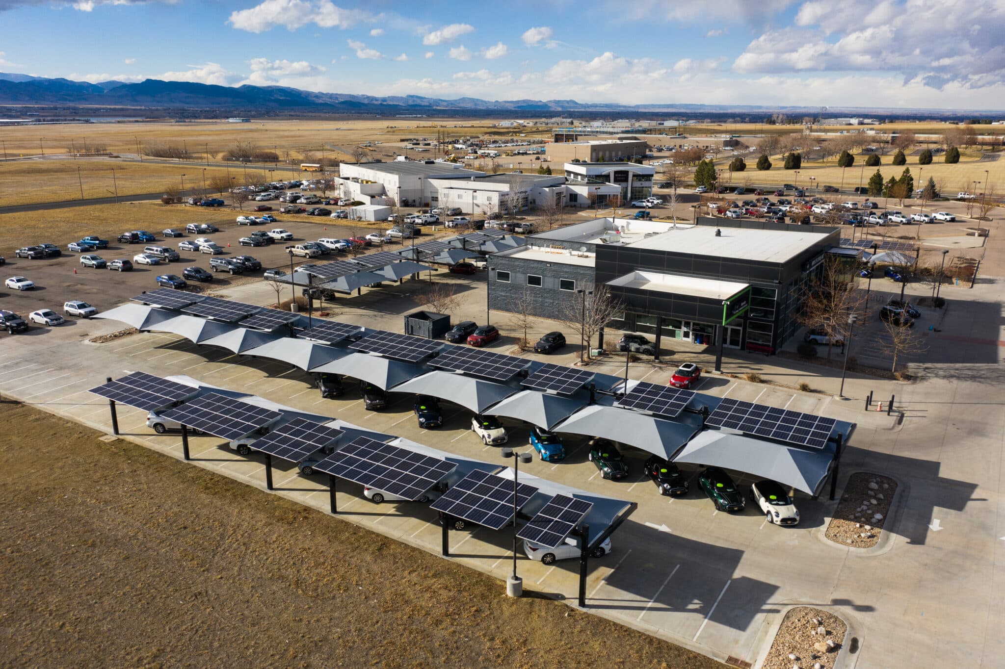 Mini of Loveland Aerial image BMW and Mini of Loveland Aerial image of dealership with solar-integrated hail canopies